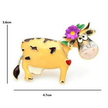 Enamel cow brooch pin, yellow body with purple flower and green leaves