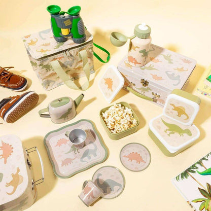 Dinosaur lunch boxes set with beige interiors and green accents laid on a table
