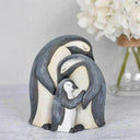 Family of Penguins Huddled Together