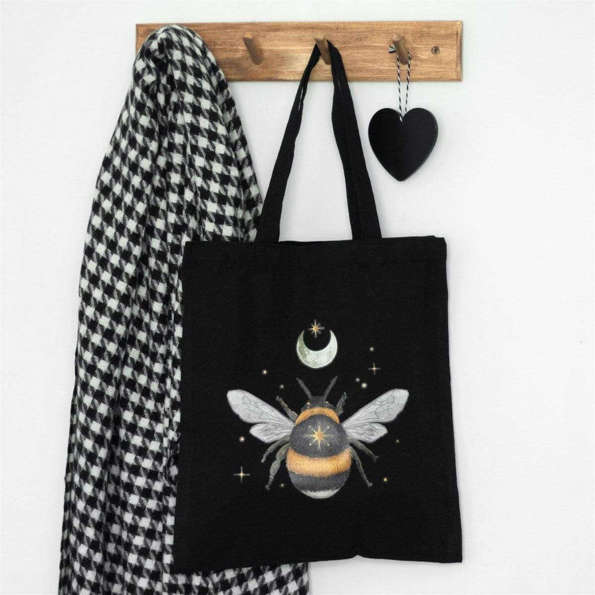 Black cotton tote bag with moon-and-bee graphic and dual fabric handles