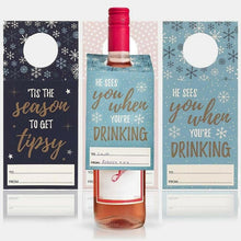 Set of 3 winter bottle gift tags with circular cutouts and holiday drinking messages