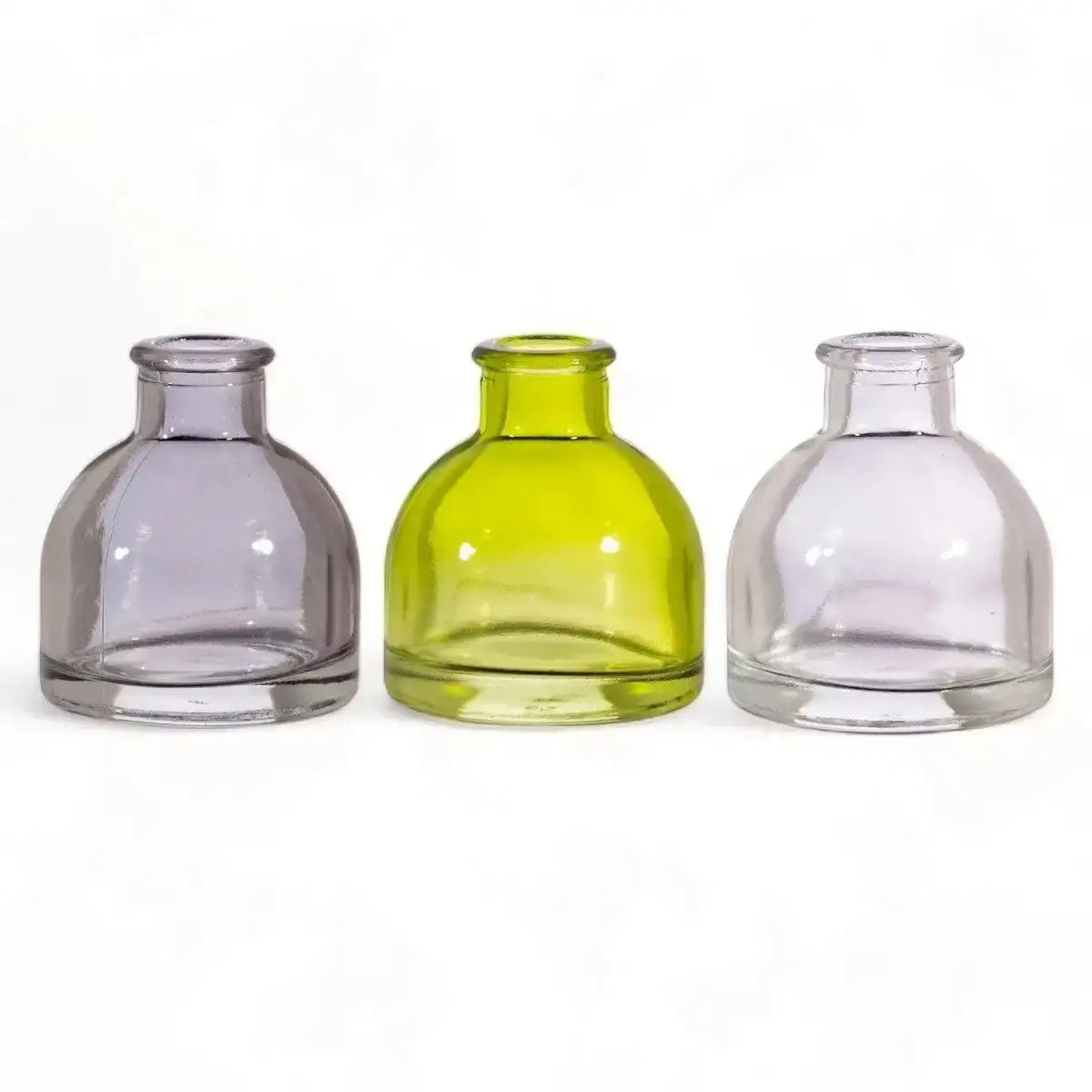 Front view of three mini glass bud vases: smoky grey, lime green, clear.