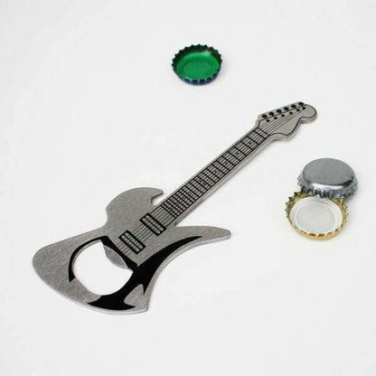 Guitar-shaped bottle opener with a green cap and bottle cap nearby