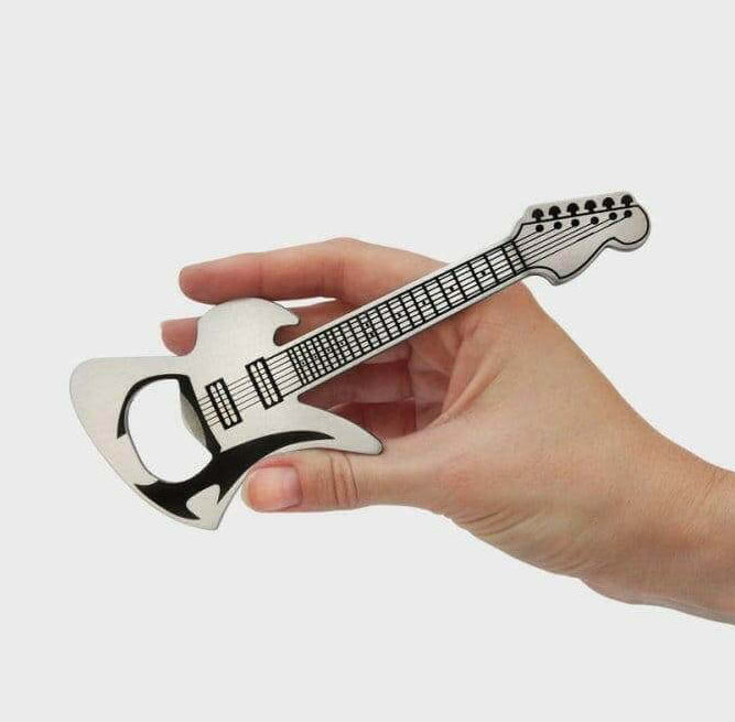 Guitar-shaped stainless steel bottle opener held in a hand