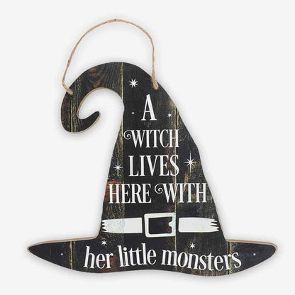 Decorative hanging sign with the inscription "A Witch Lives Here - With Her Little Monsters"