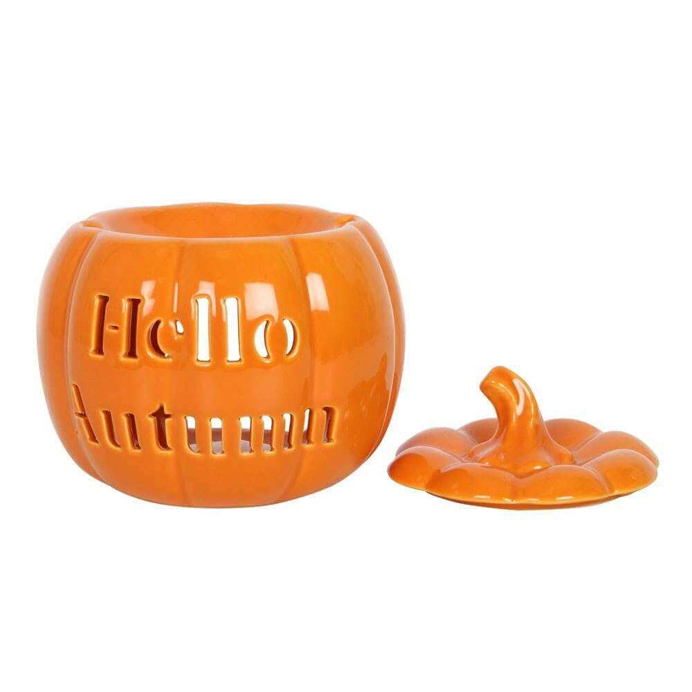 Orange pumpkin wax melt burner with carved side, open top and matching lid piece