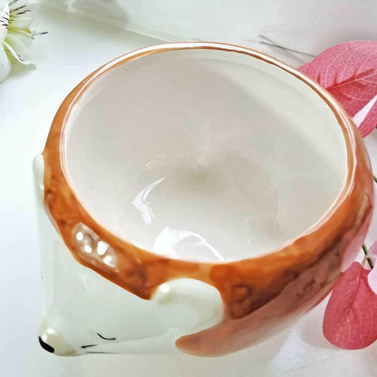 Hedgehog planter bowl close-up of white interior and brown rim with hedgehog face