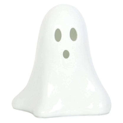 White ceramic ghost night light with two oval eye cutouts, unlit.