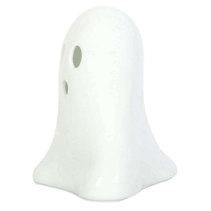 White ceramic ghost night light side view with oval eye cutouts, unlit.