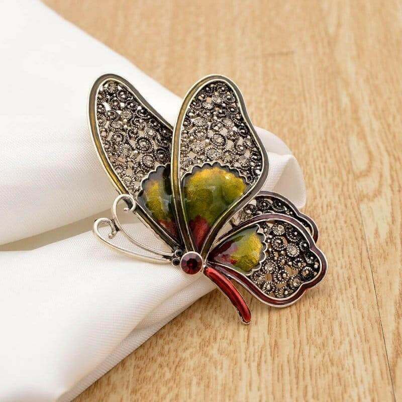 Large rhinestone butterfly brooch pin, metallic gold and dark wings, yellow center stone