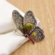 Large rhinestone butterfly brooch pin, metallic gold and dark wings, yellow center stone