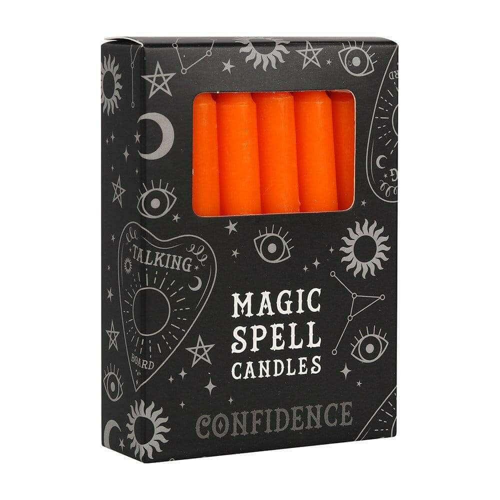 Magic spell candle box with four orange candles in a front window
