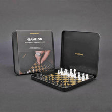 Magnetic travel chess set with pieces inside open black case
