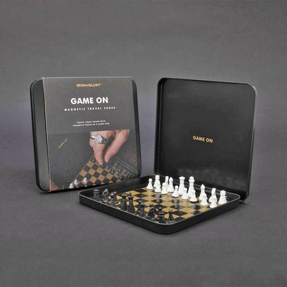 Magnetic travel chess set with pieces inside open black case