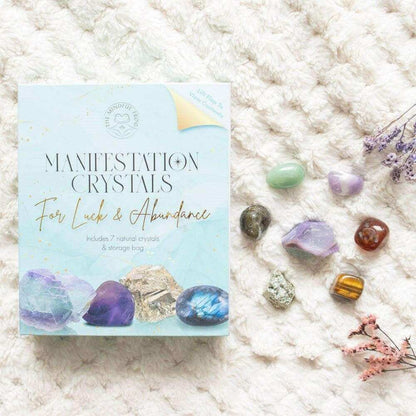 Manifestation crystal gift set with box and assorted natural crystals on fabric
