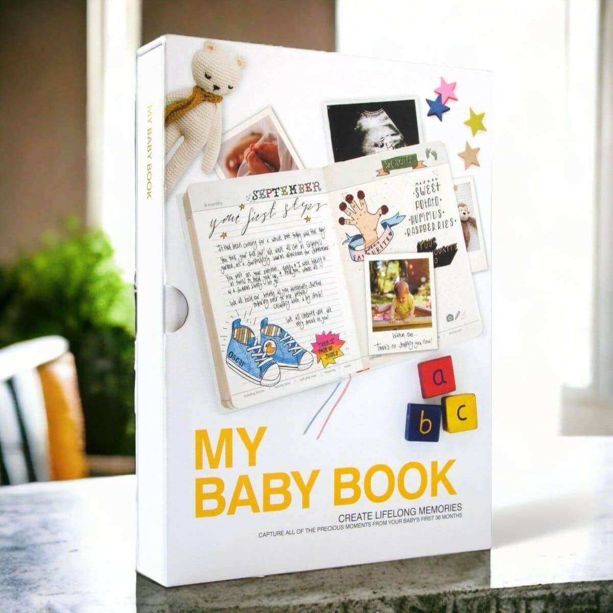 Baby book journal gift box with large “MY BABY BOOK” branding and colorful layout
