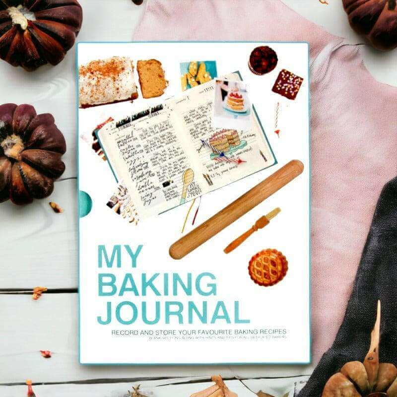 Baking journal book front cover on a table with baking-themed illustrations and title