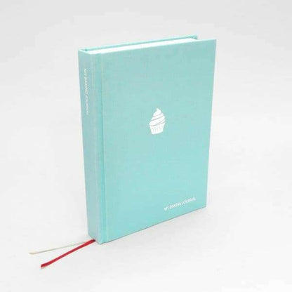 Turquoise baking journal book with a white cupcake icon on the cover