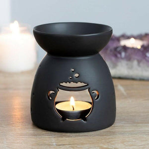 Black cauldron wax melt burner with flame and smiling face cutout