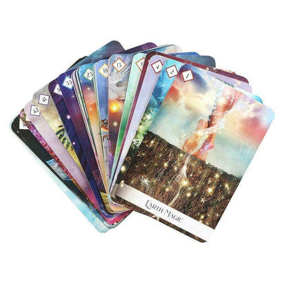 Oracle of the 7 Energies oracle cards fanned in rainbow hues with small number symbols