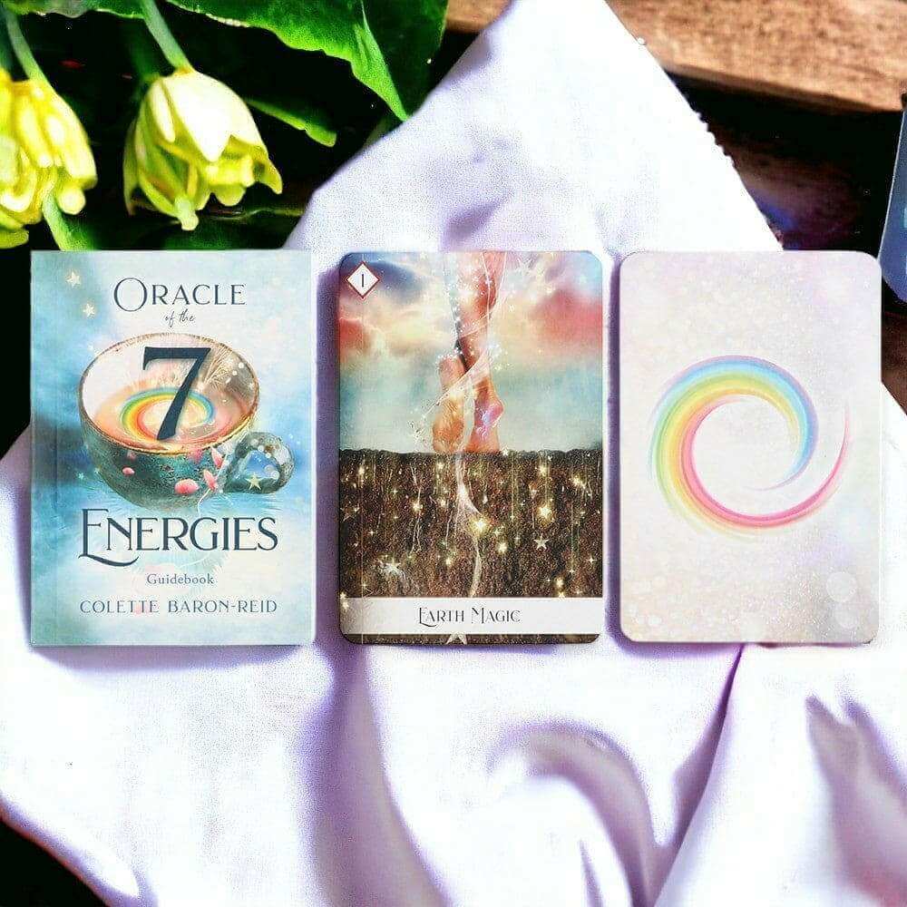 Oracle of the 7 Energies oracle card deck with one guidebook and three cards shown