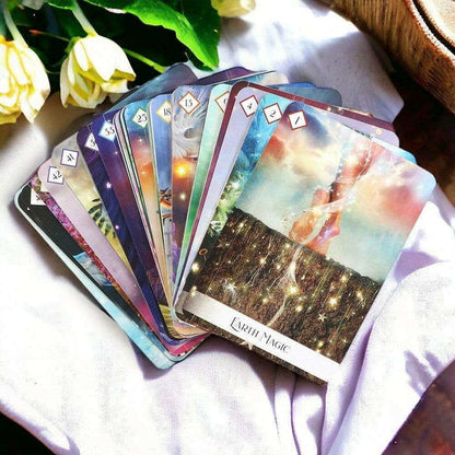 Oracle of the 7 Energies oracle cards fanned with colorful energy-themed artwork