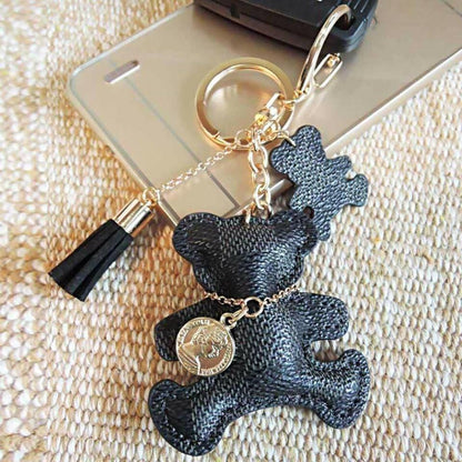Patchwork teddy bear bag charm keyring with navy bear shape, tassel, and round coin charm