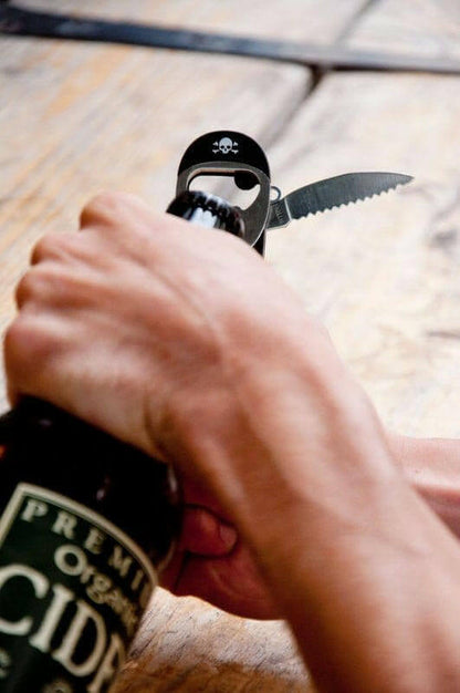 Hand using pirate waiter’s friend corkscrew on a wine bottle with black tool.