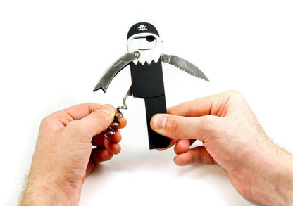Pirate bottle opener and corkscrew held by hands; black handle with silver metal ends.