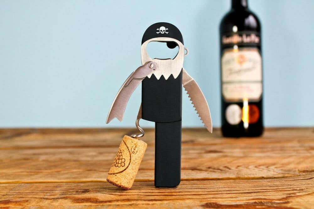 Pirate-style bottle opener and corkscrew tool with corkscrew handle and pirate figure