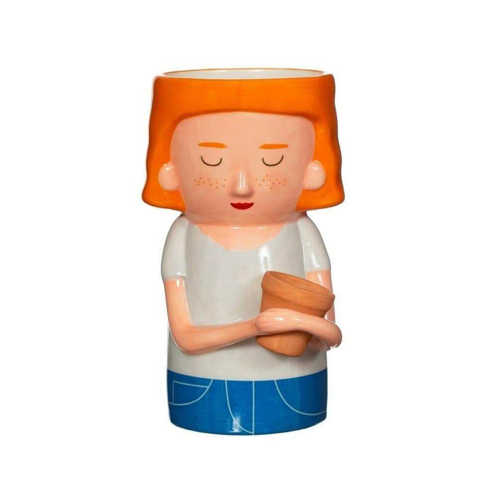 Plant mum planter face with orange hair and closed eyes, holding a terracotta pot