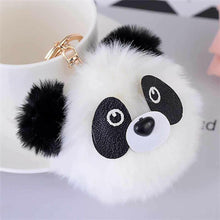 White fuzzy panda pom pom keyring charm with black ears and gold metal clasp