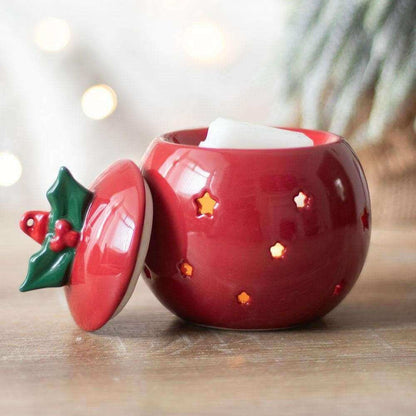 Red bauble wax melt warmer with open lid and holly ornament handle