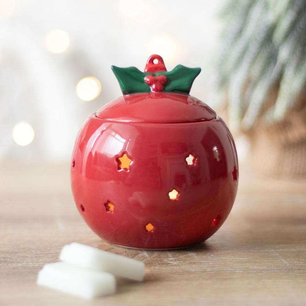 Red bauble wax melt warmer with green holly lid and gold star cutouts