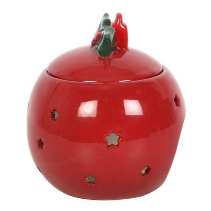 Red bauble wax melt warmer with green holly top and gold star-shaped details