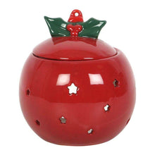 Red bauble oil burner with green holly top and gold star window cutouts