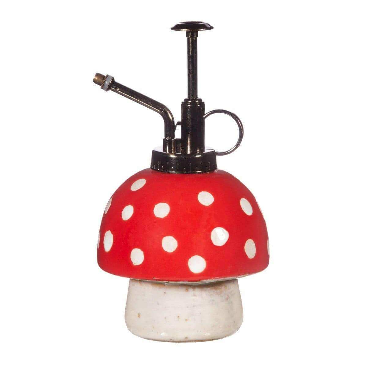 Mushroom plant mister with red polka-dot cap, black nozzle, and white base