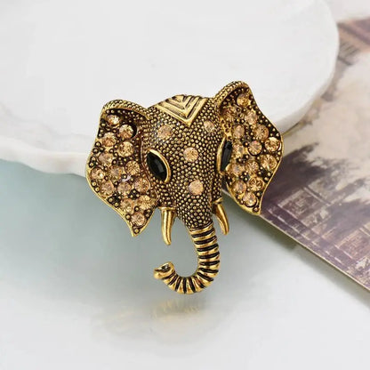 Gold elephant crystal brooch with rhinestone accents and textured trunk