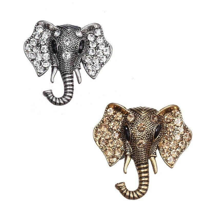 Two elephant crystal brooches: silver and gold, both with rhinestone eyes