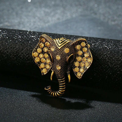 Gold elephant brooch with crystal rhinestones, detailed ears and tusks, close view