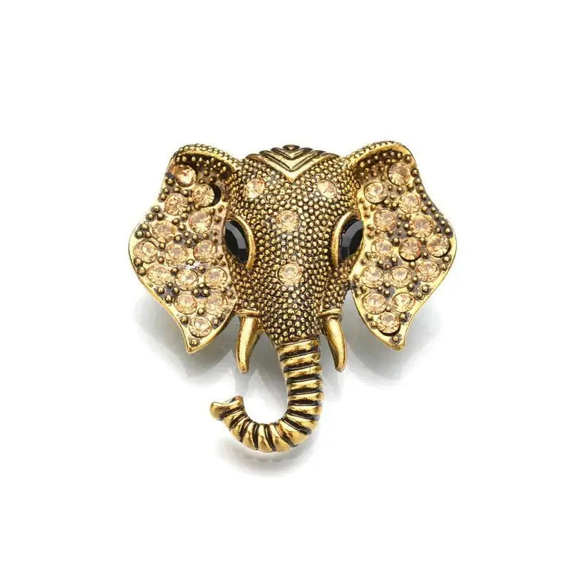 Gold elephant brooch with textured body and sparkling crystal rhinestones, front