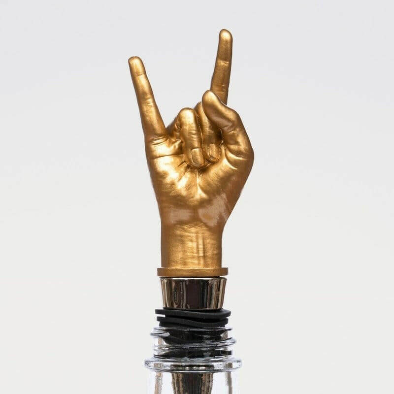 Gold peace-sign bottle stopper with black rubber ring and chrome collar
