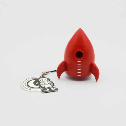 Red rocket pencil sharpener with keychain charm, showing the front sharpening hole.