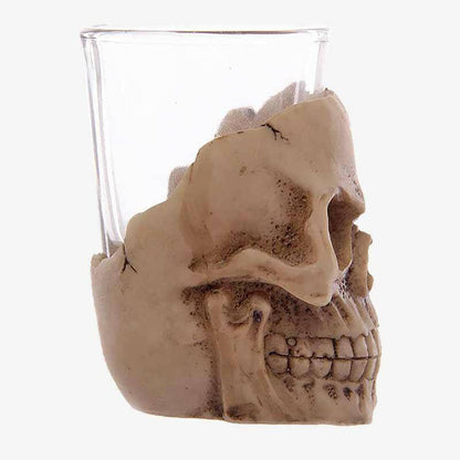Skull mini shot glass with clear cup and tan skull head detail, side view