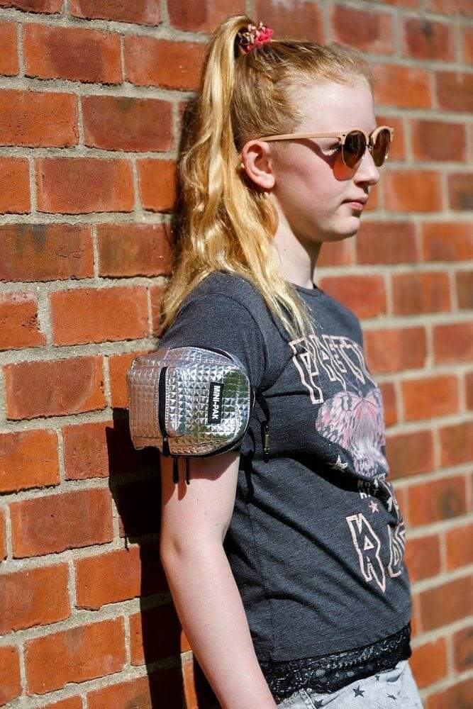 Small hands-free backpack with silver front panel and black body straps