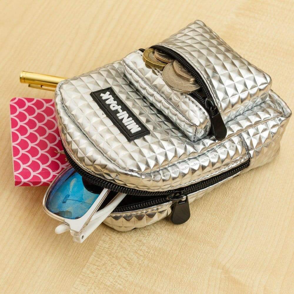 Silver mini backpack with textured front and top flap, black zipper trim and ring detail