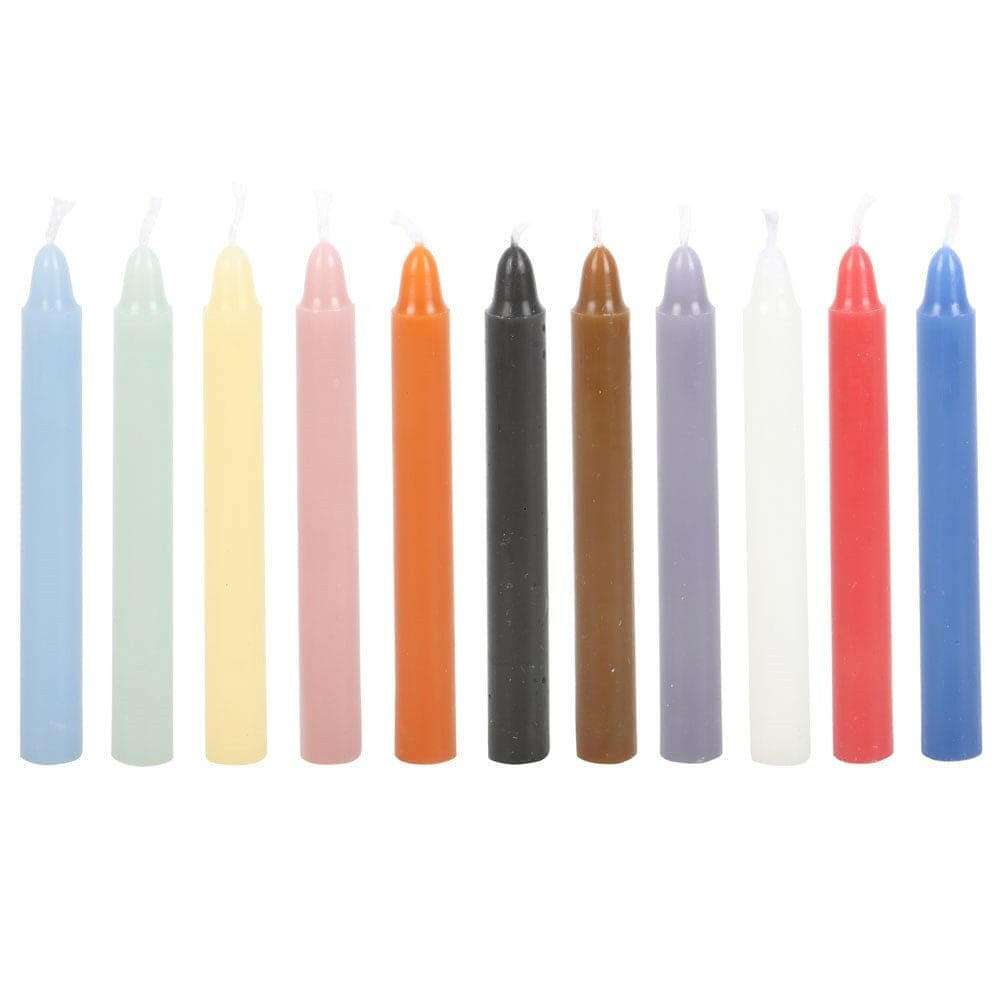 Set of 12 unscented taper candles in mixed pastel and dark colors, unlit