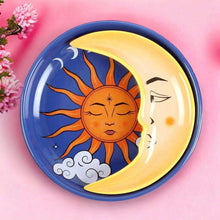 Round celestial trinket dish with blue rim, smiling sun face, crescent moon and stars