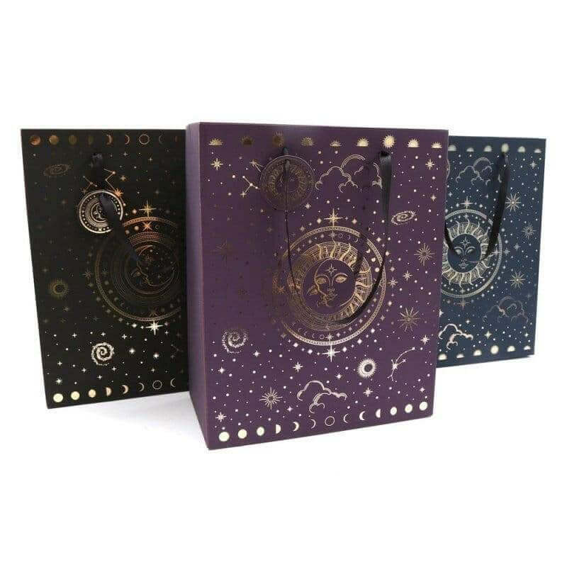 Gift bag trio in black, purple, and blue with night-sky planets and stars graphic.