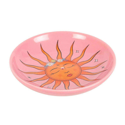 Pink incense holder dish with sun face illustration and decorative sparkles
